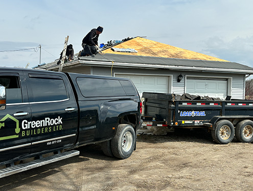 Greenrock Builders replacing a roof on a garage.