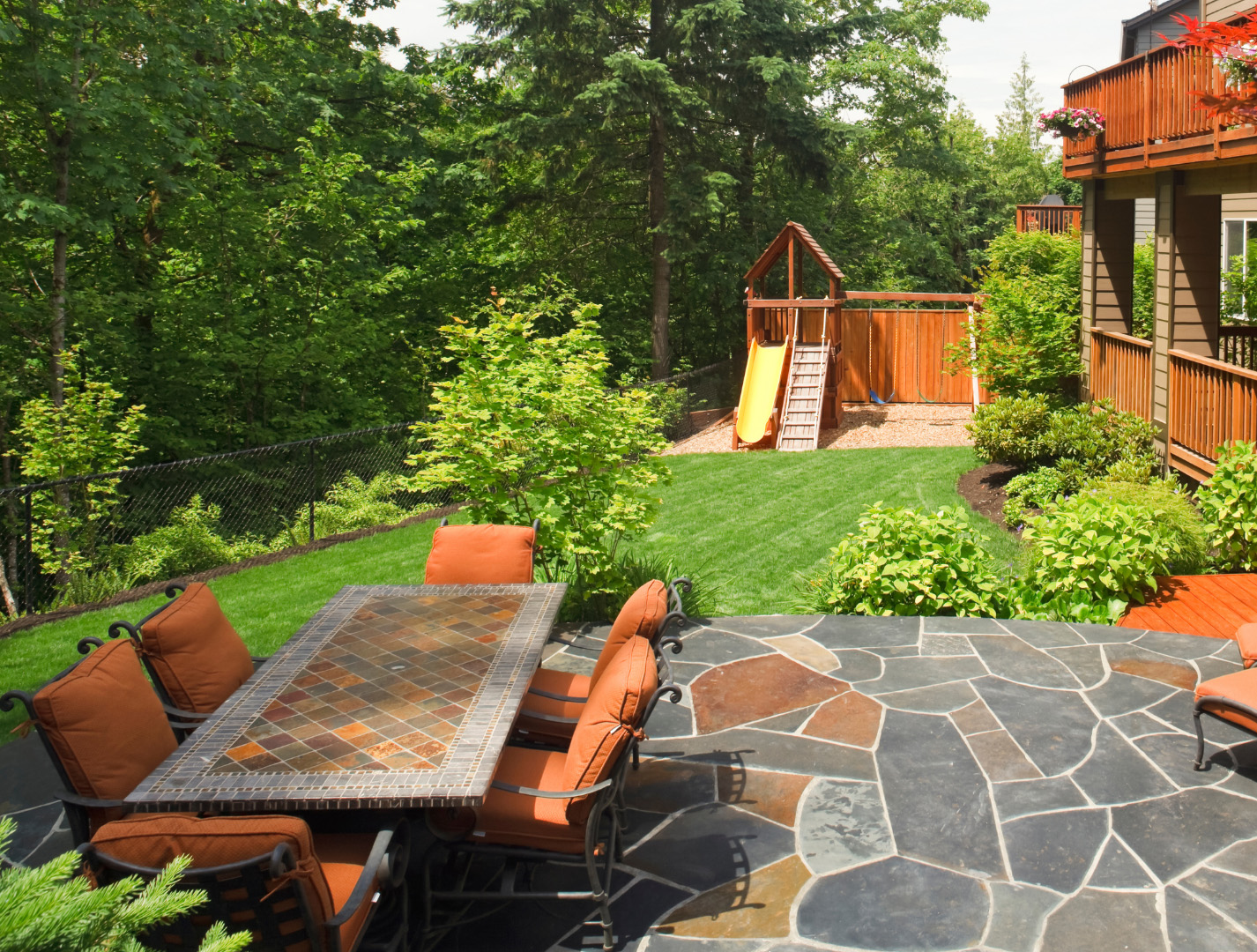 A bungalow home with new landscape construction including a new walkway and entrance stairs